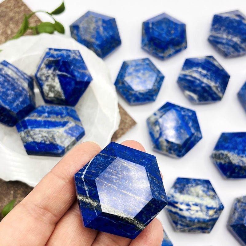 lapis lazuli hexagon in hand for size reference 