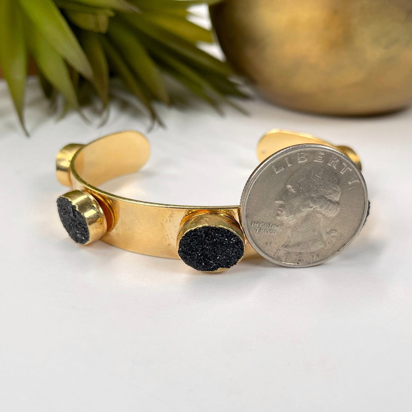 adjustable druzy cuff bracelet in electroplated gold with quarter for size reference