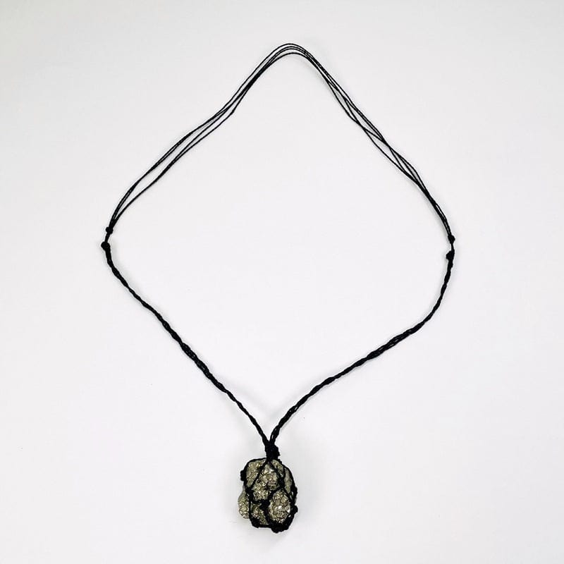 necklace displayed to show that the black cord is adjustable 