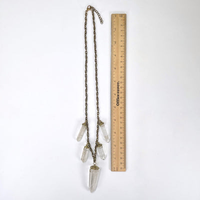 full length of crystal quartz point five pendant necklace with ruler for length reference