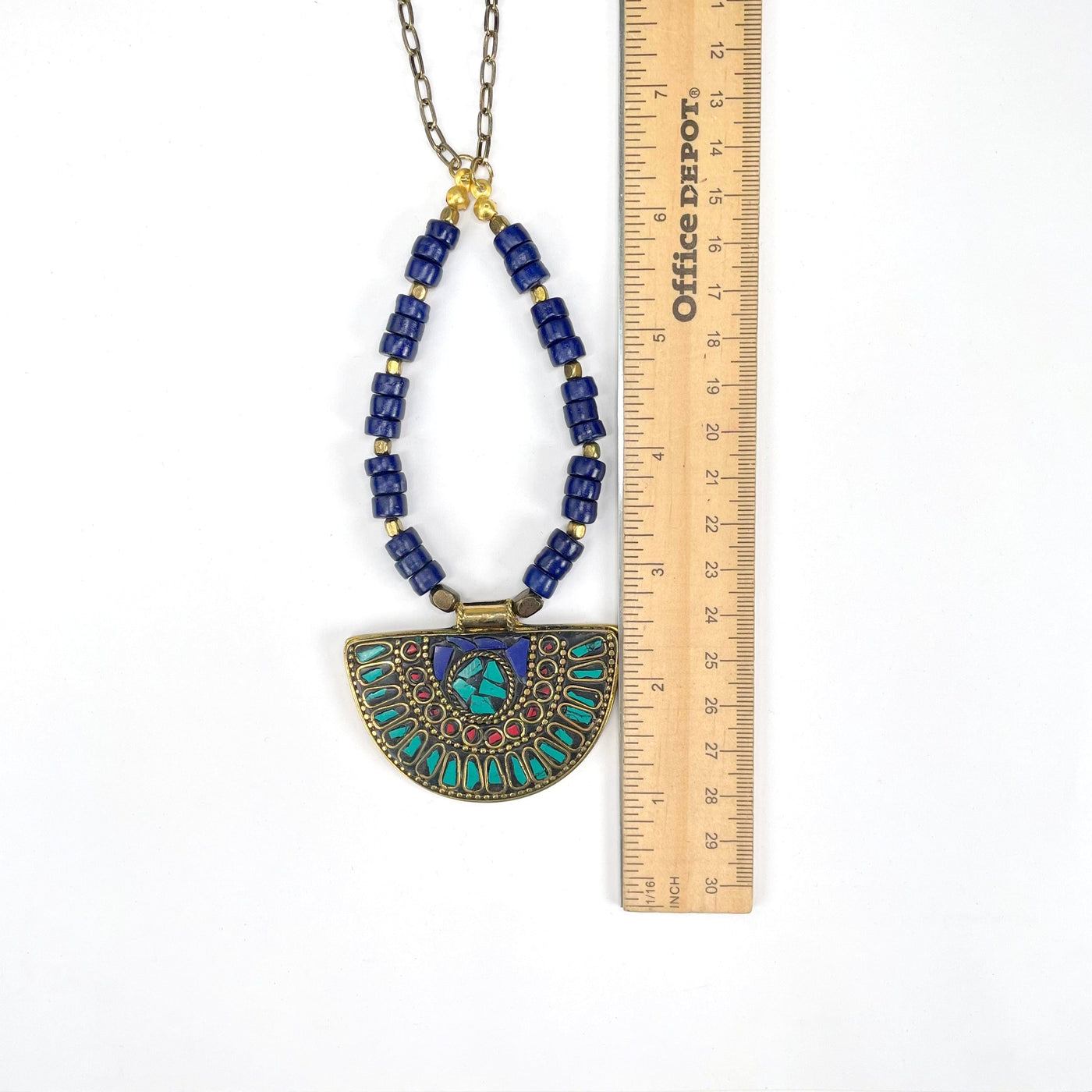pendant and beaded portion of necklace with ruler for size reference