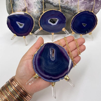 necklaces displayed to show the difference between the agate and crystal points