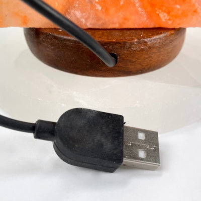 close up of back of himalayan salt orange star lamp for USB cord and plug