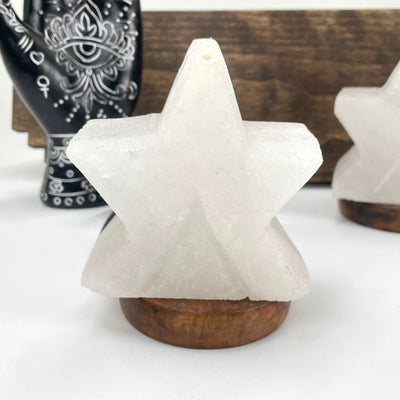 close up of one himalayan salt white star lamp on display for details