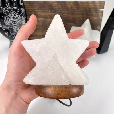 himalayan salt white star lamp in hand for size reference
