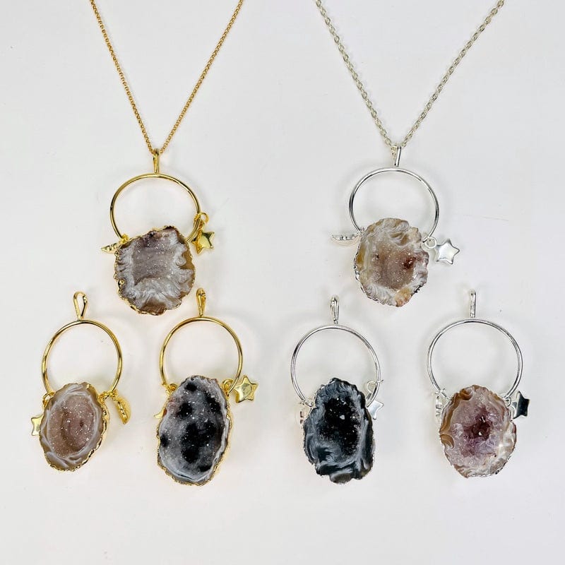 agate geode pendants with moon and star charms displayed to show the differences in the stones