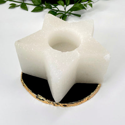 close up of one himalayan salt white star candle holder on display for details