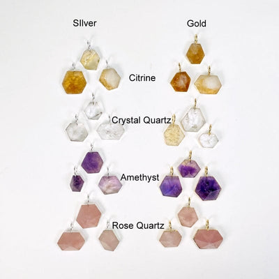 multiple pendants displayed to show the differences in the crystal types. they come in electroplated gold or silver. available in citrine, crystal quartz, amethyst and rose quartz  