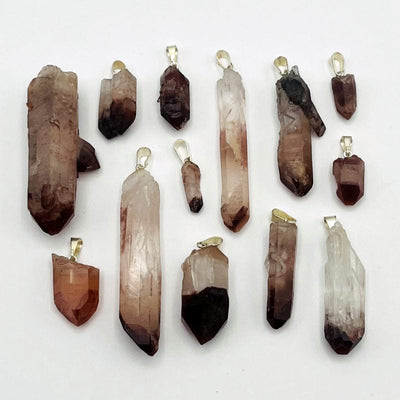 multiple pendants displayed to show the differences in the color shades and sizes 