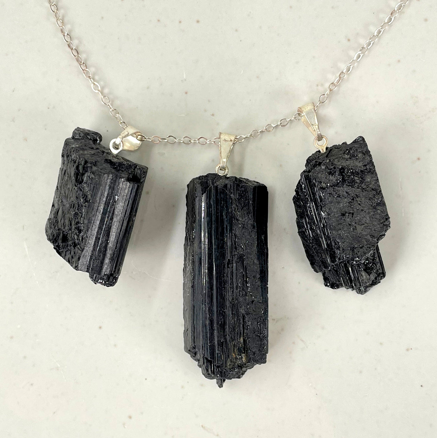 three black tourmaline rough pendants on chain