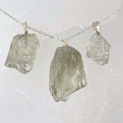 three prasiolite rough pendants on a chain