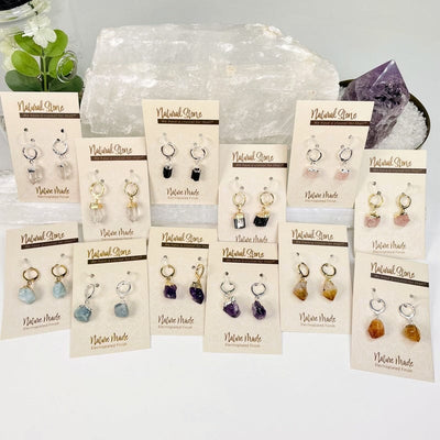 multiple natural stone earrings displayed to show the differences in the crystals available 