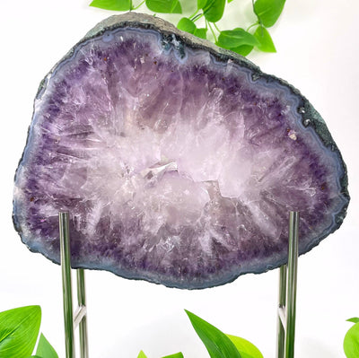 back view of large amethyst slab on stand