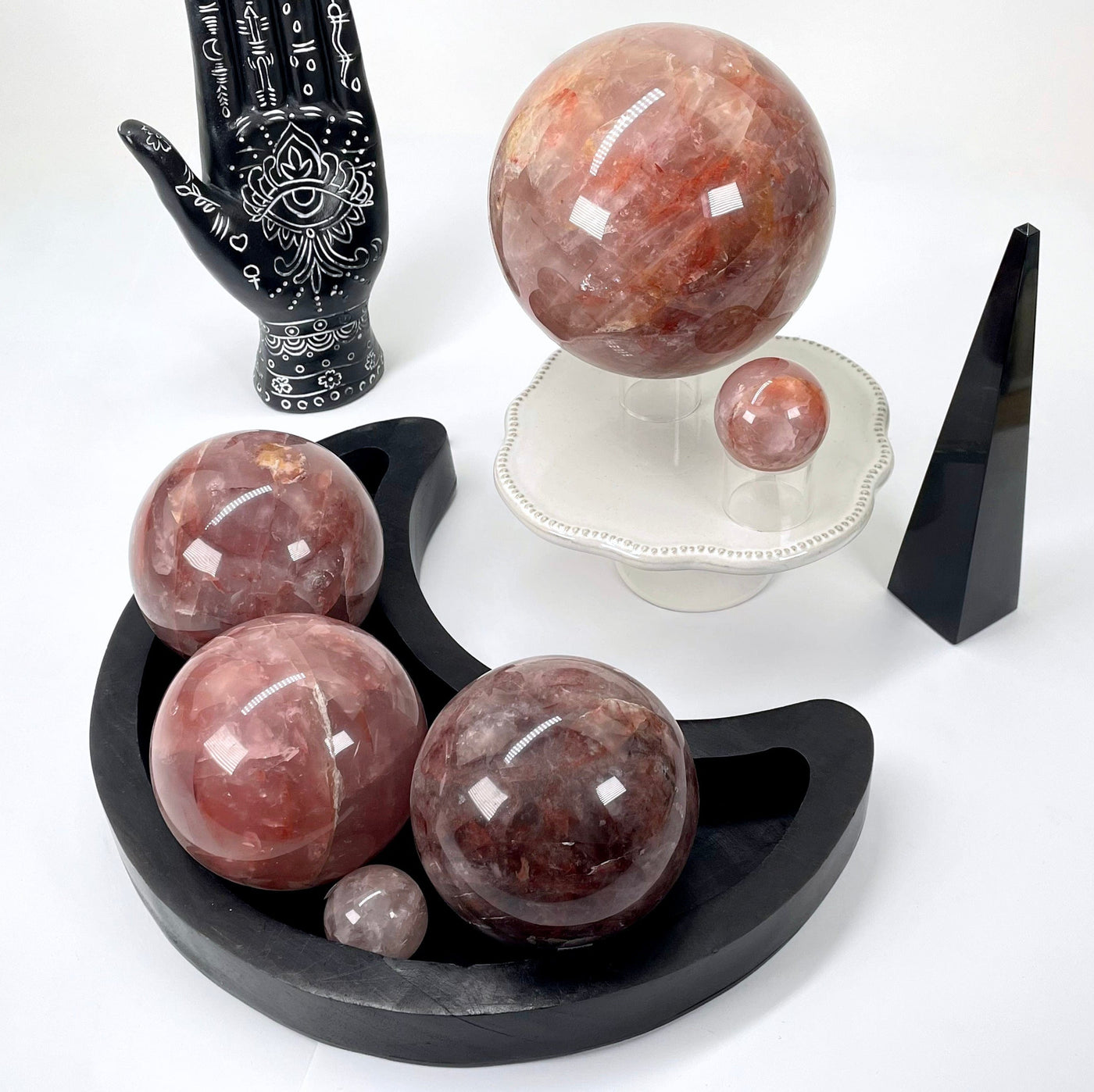 many different guava polished sphere weights on display for possible variations