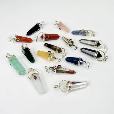 pendants displayed in different angles to show the front, back, top and bottom 