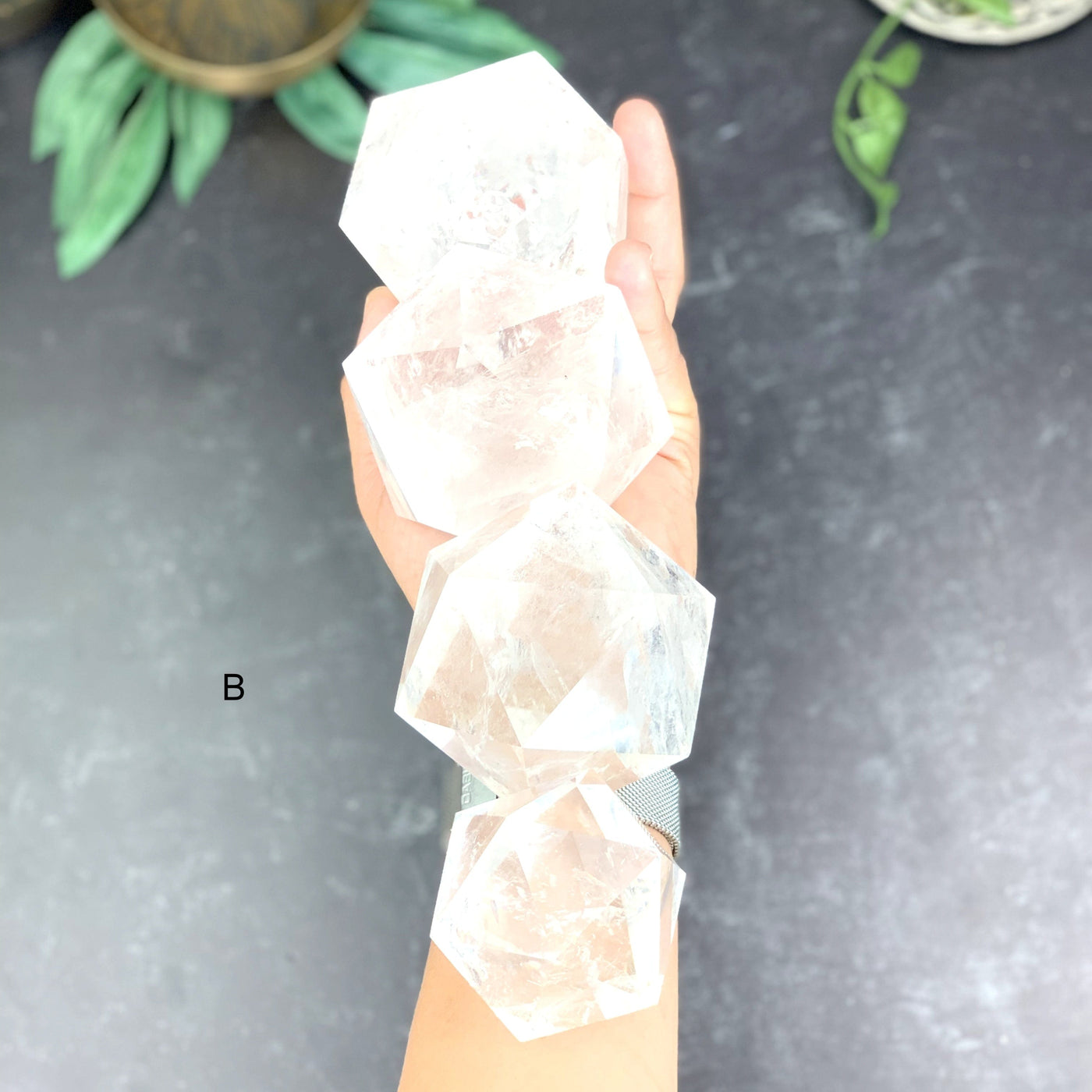 Top angle shot of 4 Crystal Icosahedron on hand holding option B.