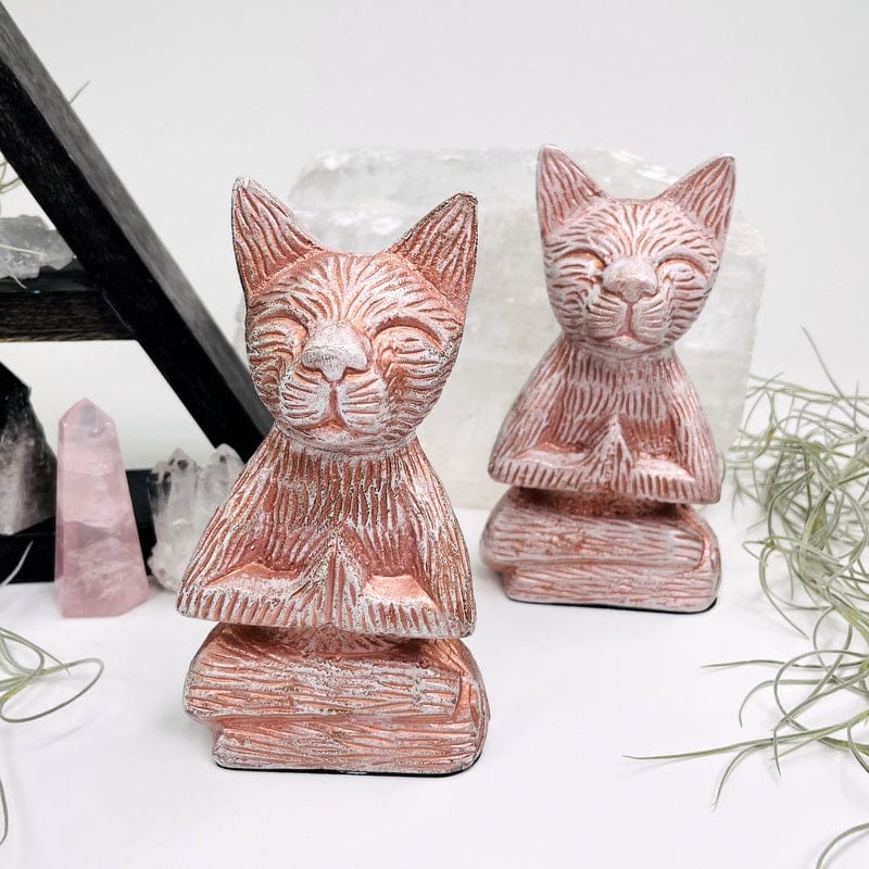 white cat with copper accents displayed as home decor 