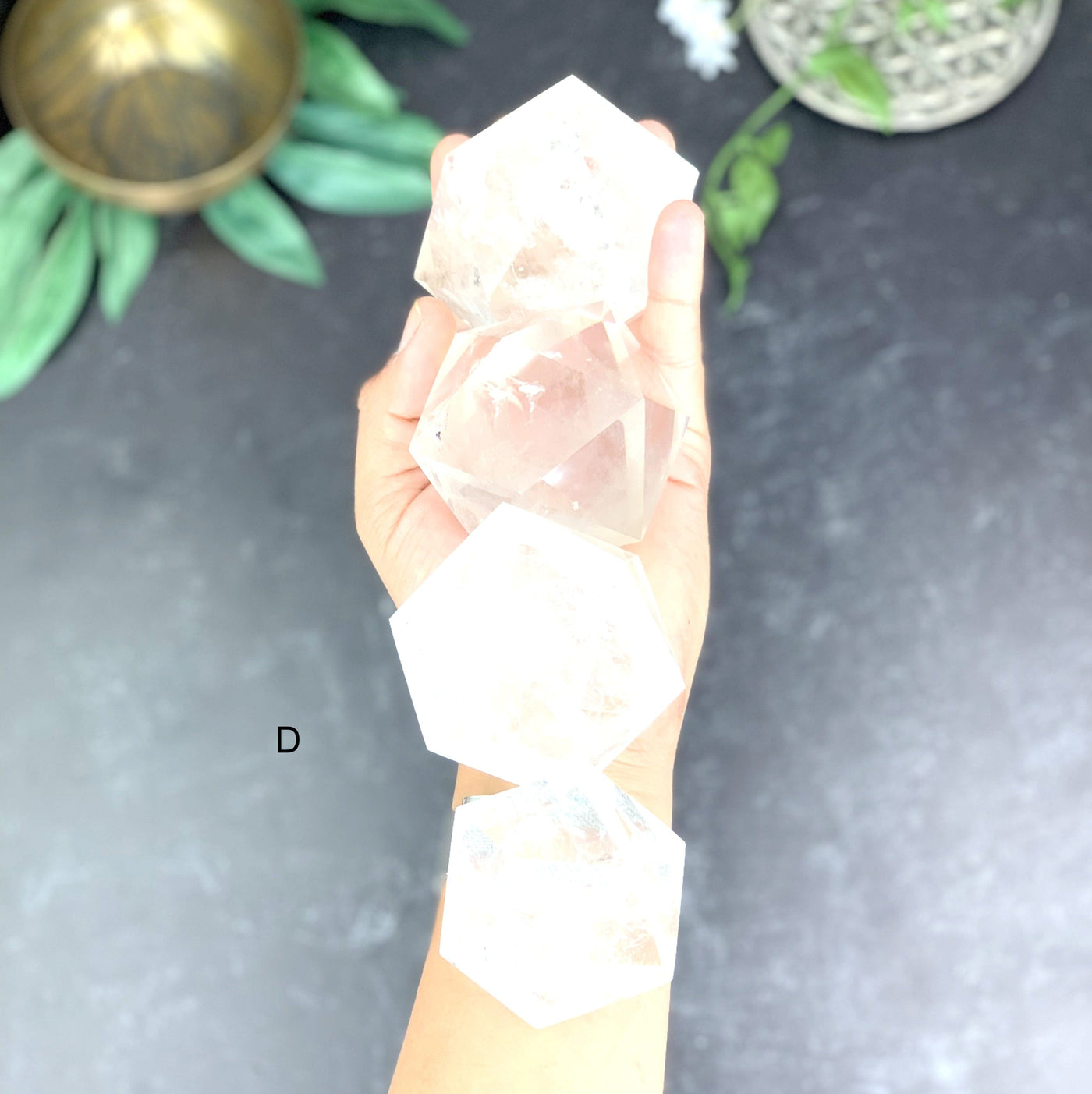 Top angle shot of 4 Crystal Icosahedron on hand holding option D.