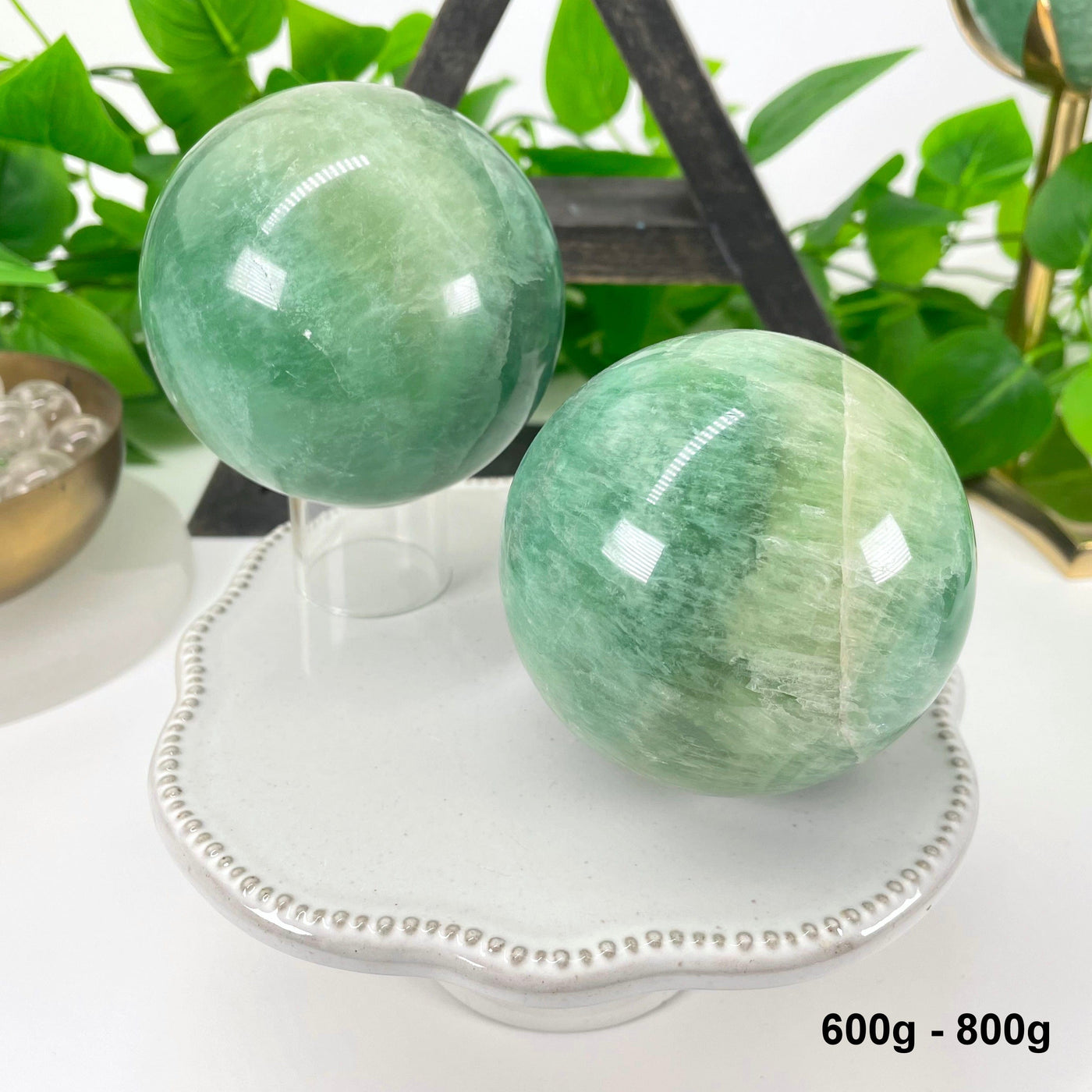 two 600g - 800g green fluorite spheres on display for possible variations