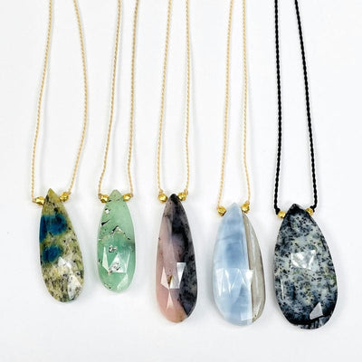 multiple necklaces displayed to show the differences in the stones available