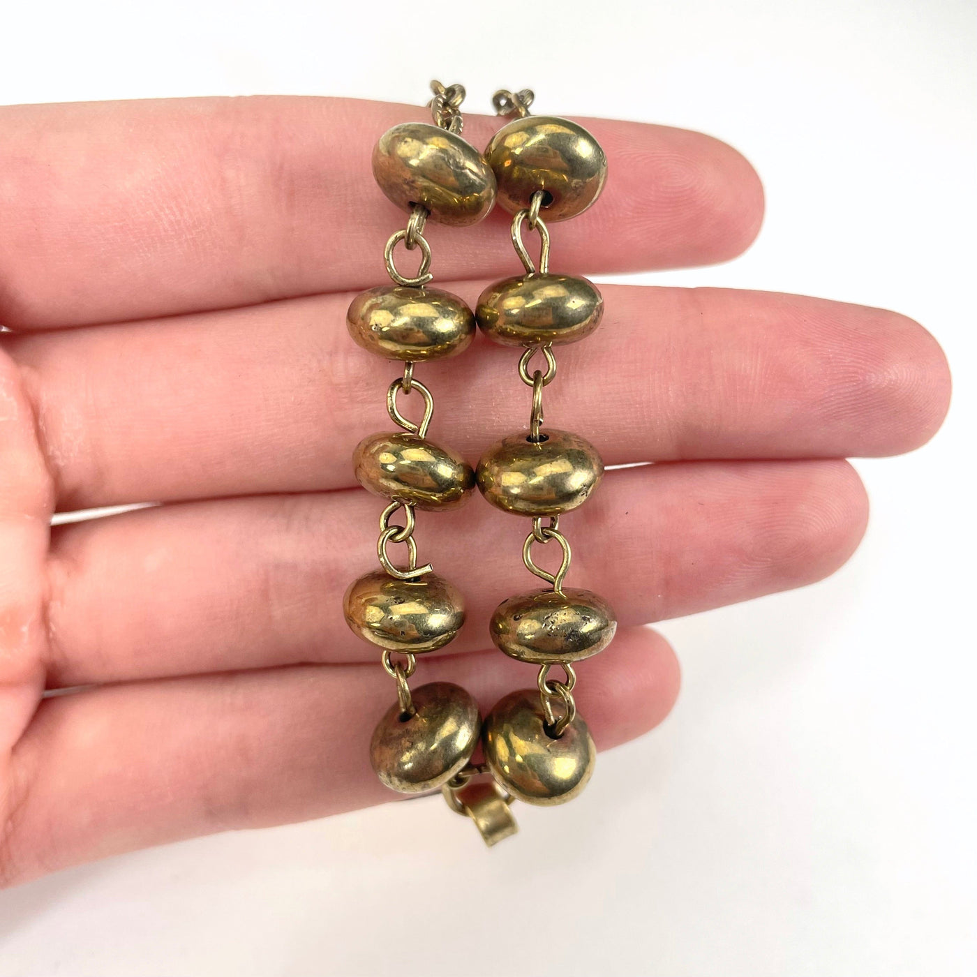 close up of tier 4 beads in hand for size reference and details