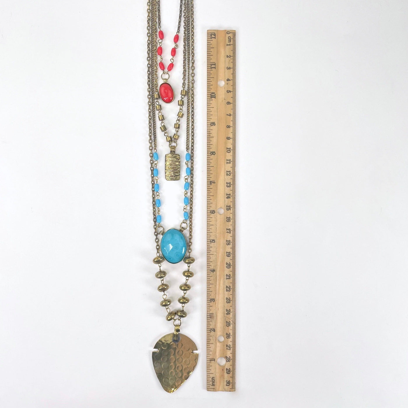 four tier beaded pendant necklace with ruler for size reference