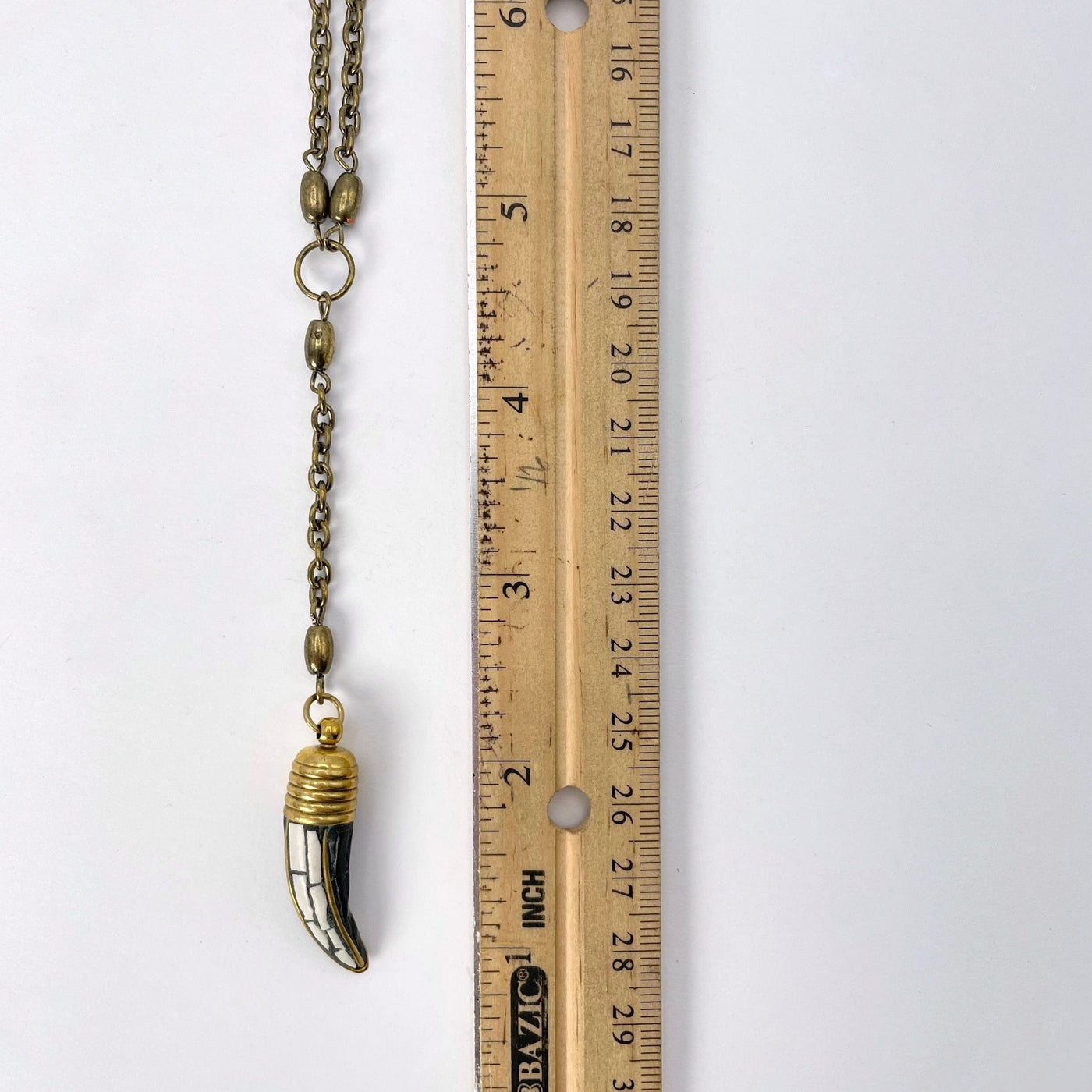 pendant chain and horn pendant with ruler for size reference