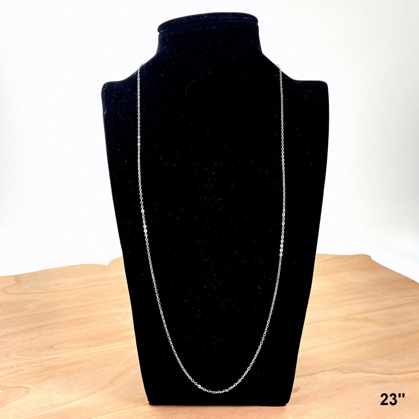 23" necklace chain on bust display for length reference