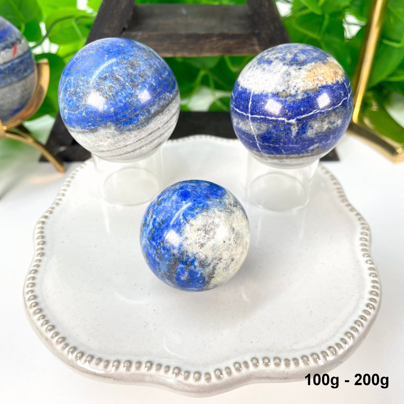 3 lapis spheres  on display on a table