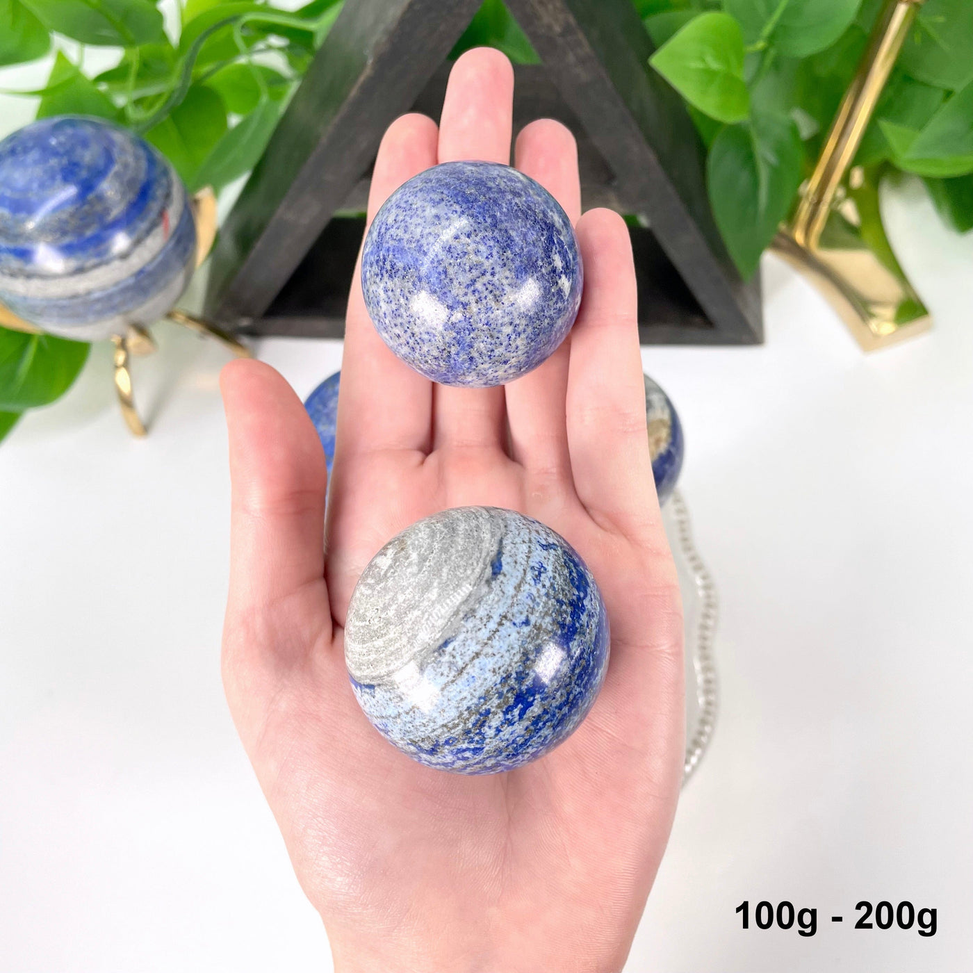 lapis spheres in a hand
