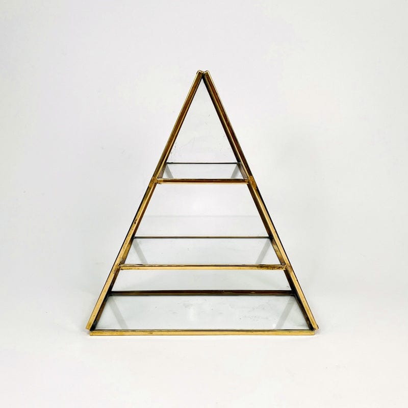 pyramid crystal display made out of brass with glass shelves 