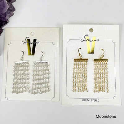 gold and silver moonstone gemstone cascade earrings on white background