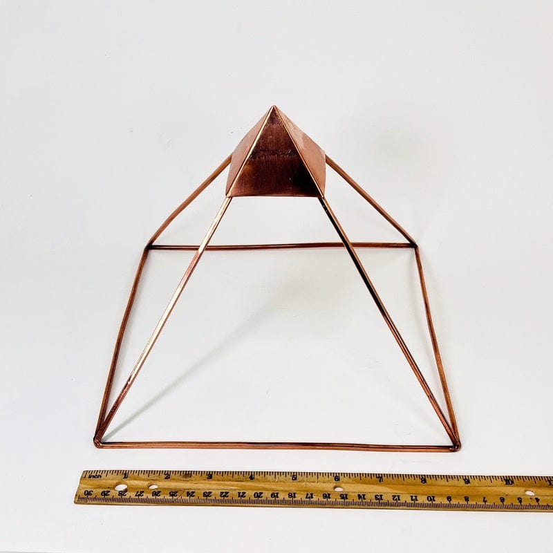 pyramid next to a ruler for size reference 