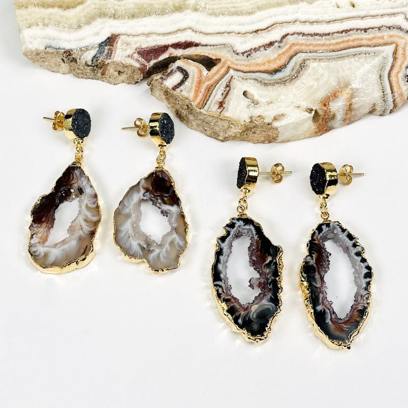 earrings are electroplated in gold and have a titanium finished round druzy accent 