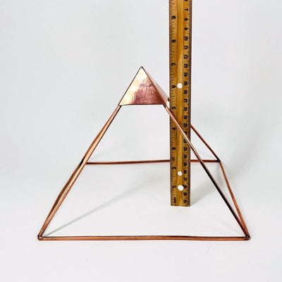 pyramid next to a ruler for size reference 