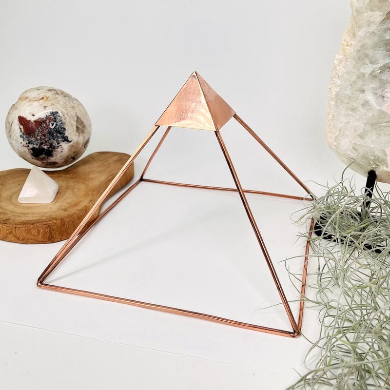 copper pyramid set up as home decor 