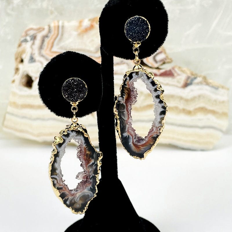 agate earrings on stand to show how they hang 