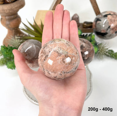 one 200g - 400g sphere in hand for size reference