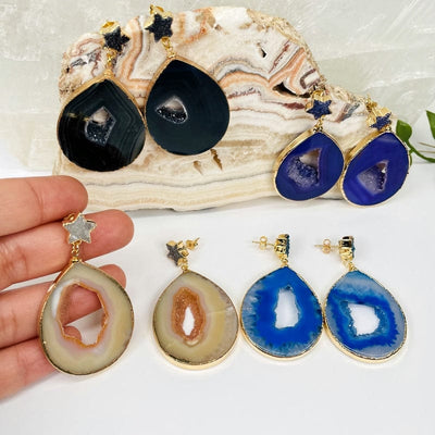 agate earrings with star druzy accent in hand for size reference