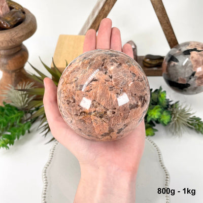 one 800g - 1kg sphere in hand for size reference