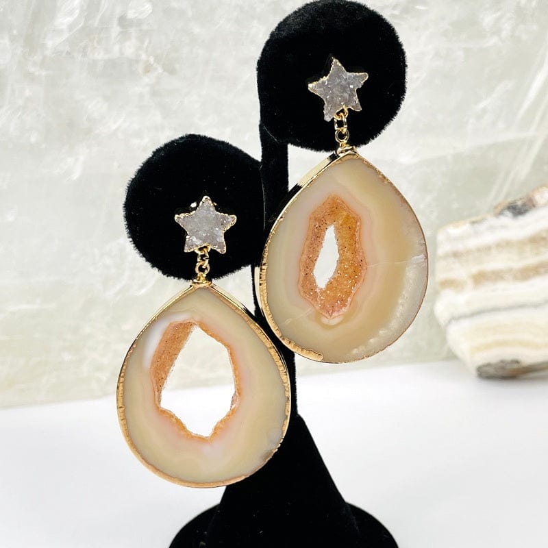 close up of the agate earrings with a star accent in natural
