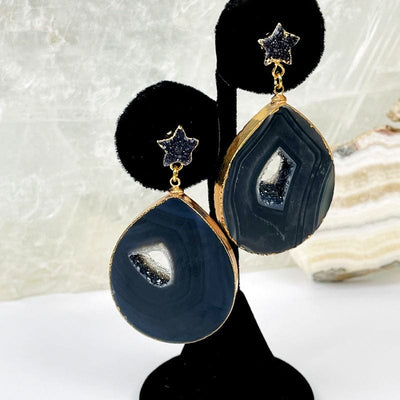 close up of the agate earrings with a star accent in black