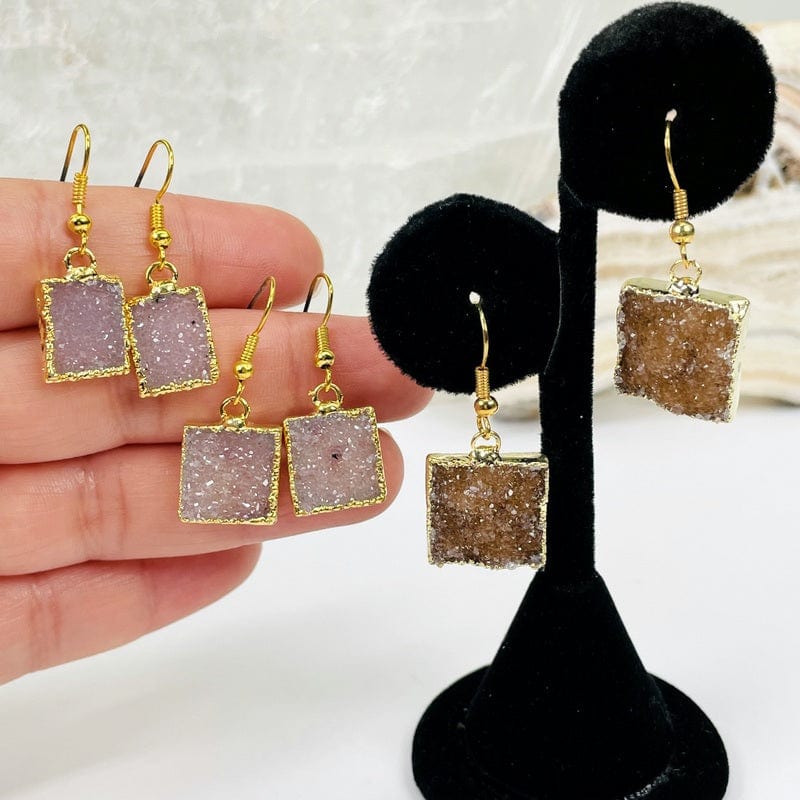 earrings displayed in hand for size reference 