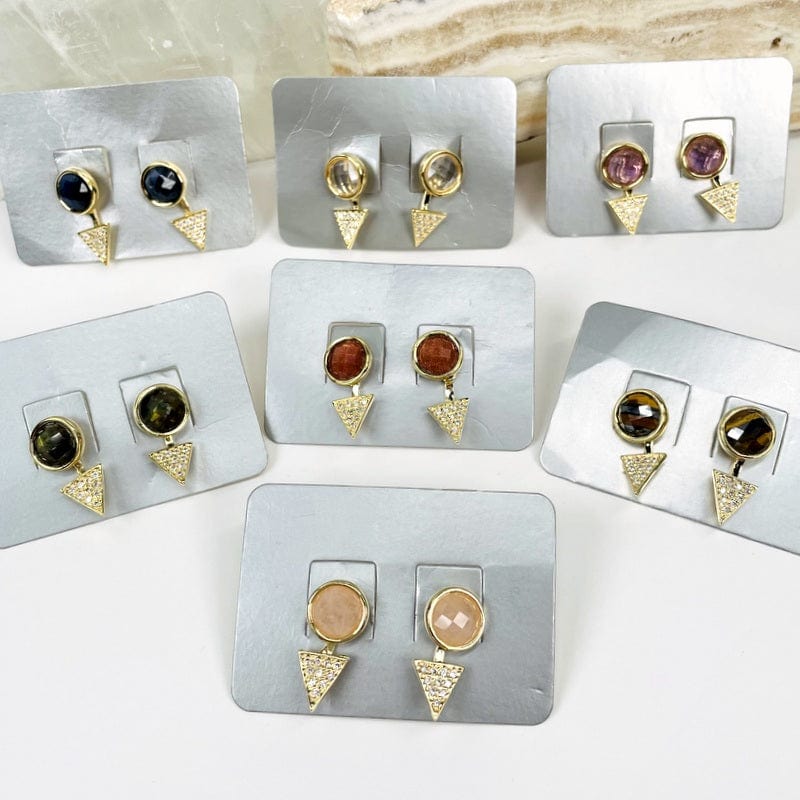 multiple earrings displayed to show the differences in the gemstones 