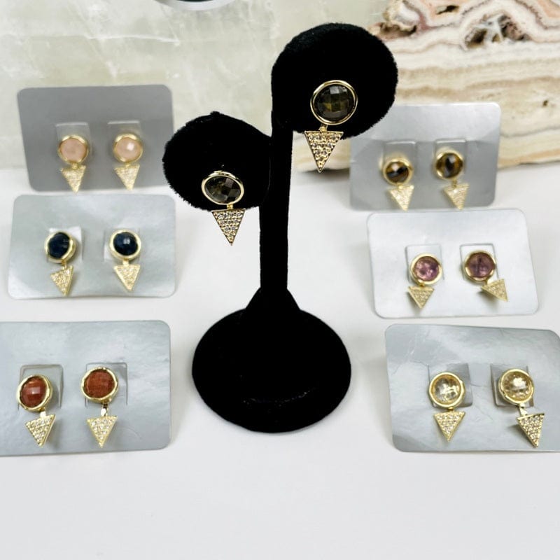 multiple gemstone earrings displayed to show the differences in the crystal types 