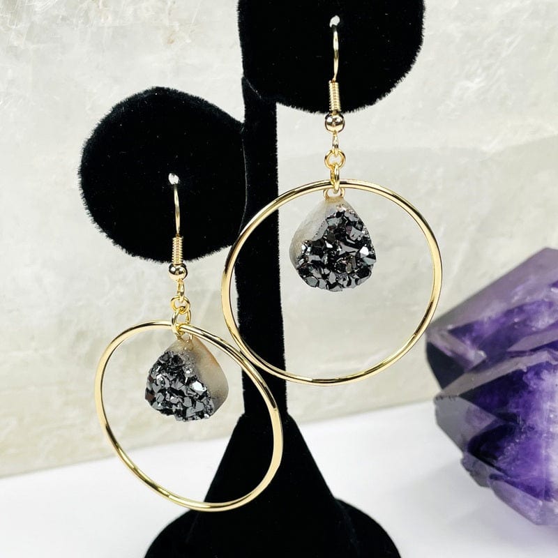 hoop style earrings displayed to show how they hang 