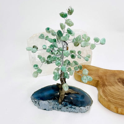 green quartz tumbled stone top tree available with a blue agate base
