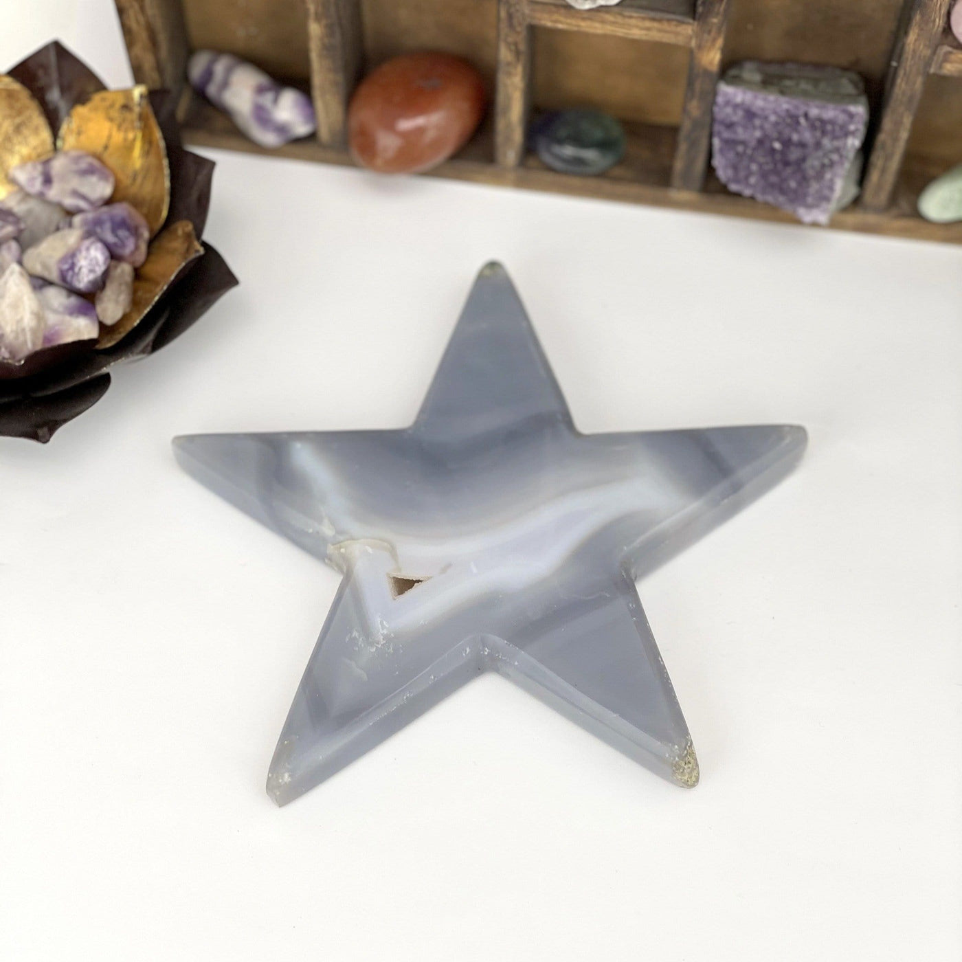 Back side view of Agate Druzy Star - Large Polished Star (DOOAK-S9-60) on a white background within an alter.