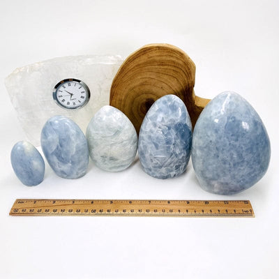 blue calcite cut base next to a ruler for size reference. these are sold by weight 