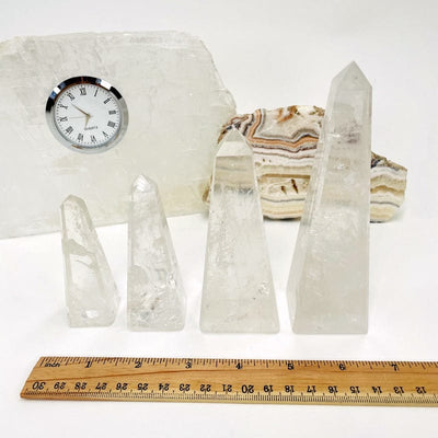 crystal quartz obelisk next to a ruler for size reference 